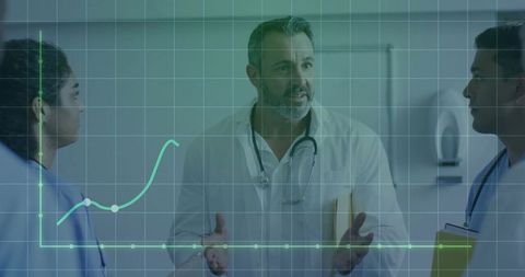 Medical team analyzing data with digital graph in hospital corridor