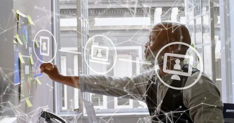African American Businessman Analyzing Digital Data in Office - Download Free Stock Images Pikwizard.com