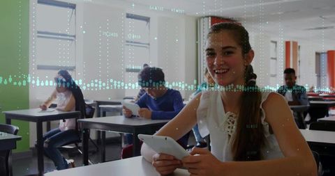 Smiling Teenager with Tablet in Classroom Embracing Digital Learning