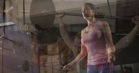 Female Athlete Doing Squats and Rope Skipping at Gym