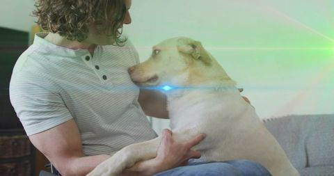 Man Cuddling Dog in Cozy Living Room Ambience