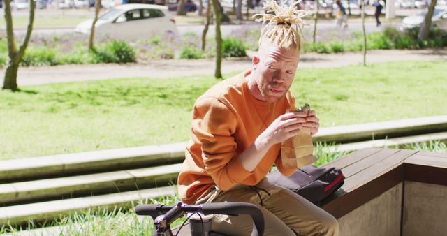 Man Having Snack Break Outdoors in Urban Park - Download Free Stock Images Pikwizard.com