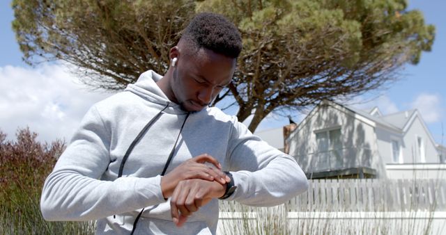 Man Checking Fitness Watch While Running Outdoors - Download Free Stock Images Pikwizard.com