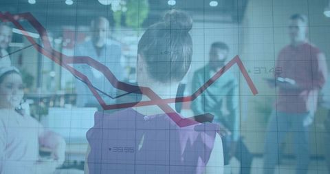 Leading presenter guiding team through financial chart in open-plan office