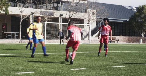 Youth soccer team training for penalty kick outdoors