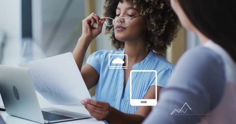 Diverse Business Professionals Analyzing Financial Data with Digital Interface