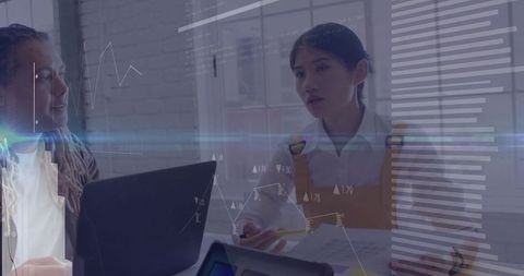 Business Professionals Discussing Data Analytics in Office