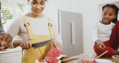 Family Enjoying Quality Cooking Time with Watermelon