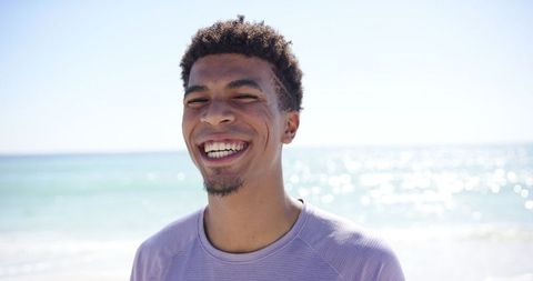 Cheerful Young Man Enjoying Sunny Beach Day - Download Free Stock Images Pikwizard.com