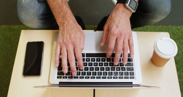 Man Typing on Laptop Keyboard with Smartphone and Coffee Cup - Download Free Stock Images Pikwizard.com