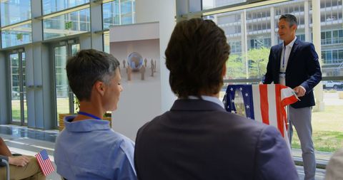 Caucasian male speaker at business seminar with audience