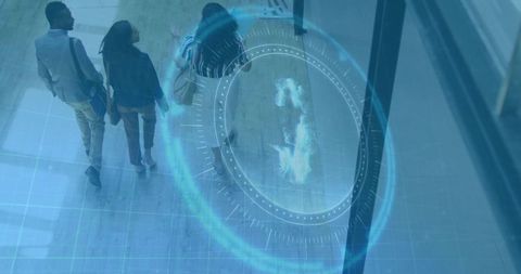 Business team walking through modern glass lobby with blue holographic interface overlay