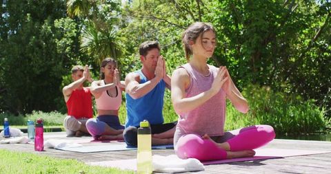 Yoga Group Meditating in Outdoor Park Setting