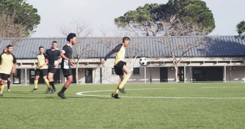 Amateur Soccer Team Practicing on Field Emphasizing Passing Skills