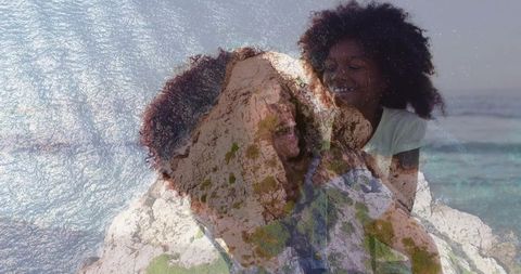 Black mother laughing carrying daughter piggyback on sunlit coastal cliff double exposure
