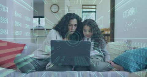 Mother and daughter learning on laptop with futuristic data HUD overlay in living room