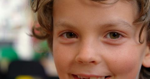 Joyful Young Schoolboy in Classroom Setting
