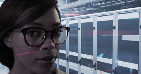 African American Woman Analyzing Data in High-Tech Server Room