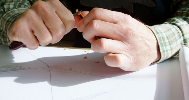 Carpenter Sharpening Carpenter's Pencil on Table - Download Free Stock Images Pikwizard.com