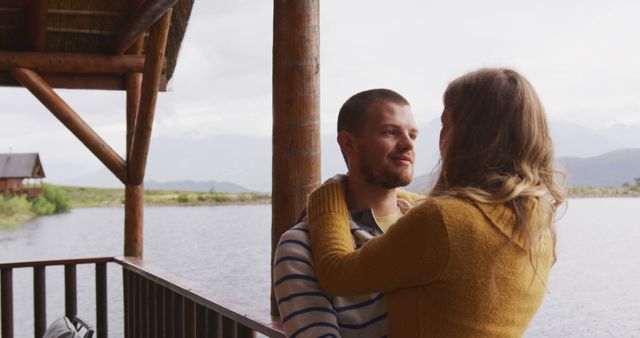 Loving Couple Embracing On Wooden Porch By Lake - Download Free Stock Images Pikwizard.com