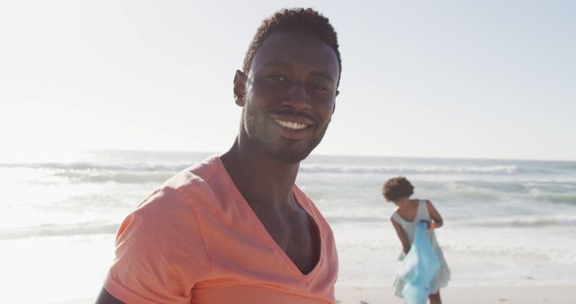 Smiling Man Enjoying Beach Day with Partner - Download Free Stock Images Pikwizard.com