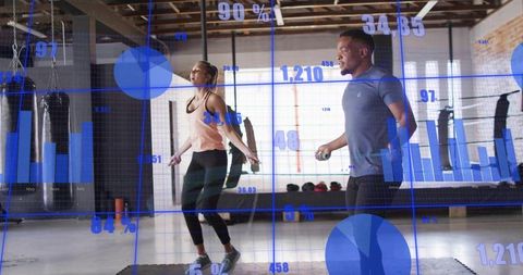 High-intensity jump rope cardio duo in industrial gym with live fitness analytics overlay
