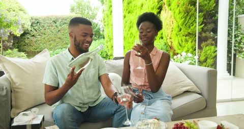 Couple enjoying refreshing sparkling water outdoors