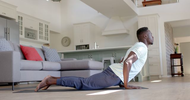 Young Man Practicing Yoga in Modern Living Room - Download Free Stock Images Pikwizard.com