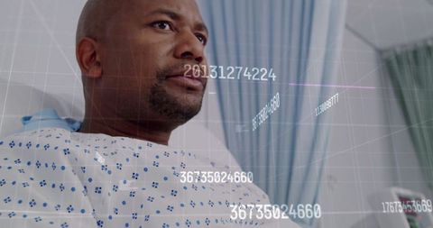 Patient observing diagnostic data in hospital room