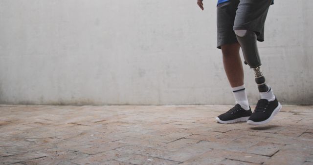 Close-Up of Young Man with Prosthetic Leg Walking Outdoors - Download Free Stock Images Pikwizard.com