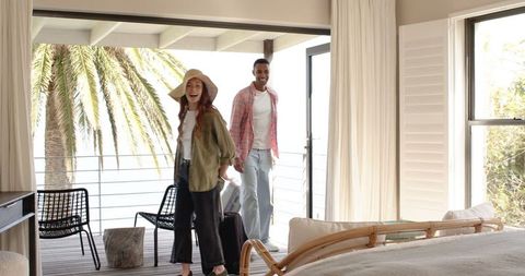 Couple Enjoying Tropical Vacation in Luxurious Bedroom Escape