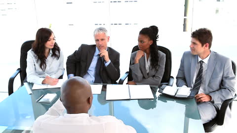 Diverse Business Team Engaging in Meeting Discussion