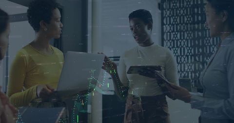 Diverse Team Discussing Digital Data Strategies in Modern Office