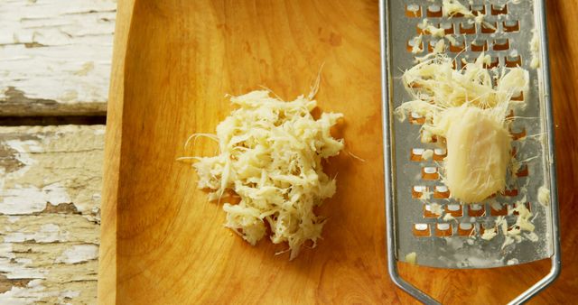 Close Up of Fresh Grated Ginger on Rustic Wood Surface - Download Free Stock Images Pikwizard.com