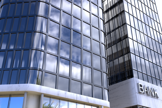 Low Angle View of Transparent Modern Bank Building Against Blue Sky - Download Free Stock Videos Pikwizard.com