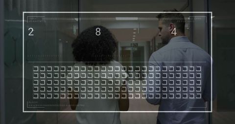 Colleagues Entering Futuristic Office Corridor with Digital Interface