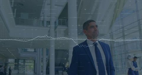 Businessman Analyzing Financial Trends in Modern Office