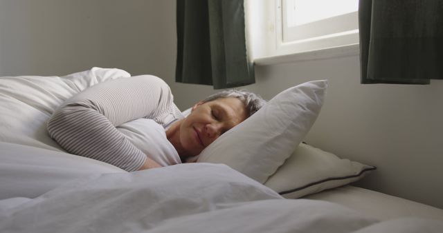 Senior Woman Peacefully Sleeping in Cozy Bedroom - Download Free Stock Images Pikwizard.com