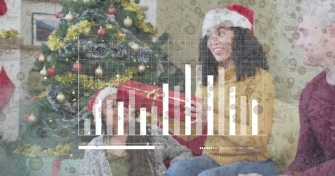 Family exchanging Christmas gift with digital data overlay and festive living room scene