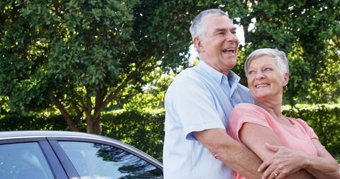 Senior Couple Embracing Outdoors with Joyful Expressions - Download Free Stock Images Pikwizard.com