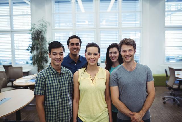 Group of business executives smiling at camera in the office