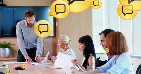 Diverse Business Team Collaborating on Social Media Analytics