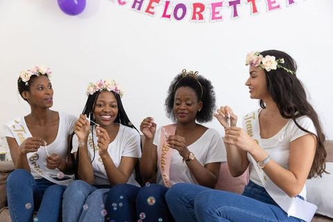 Diverse Women Celebrating with Bubbles at Bachelorette Party