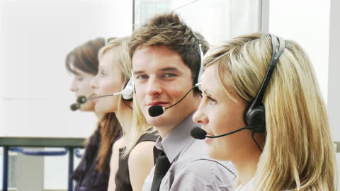 Customer Service Team Using Headsets for Communication