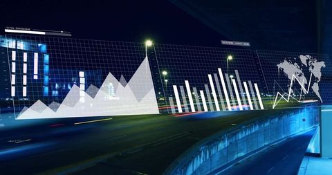 Futuristic data visualization overlay on urban highway at night with neon light trails
