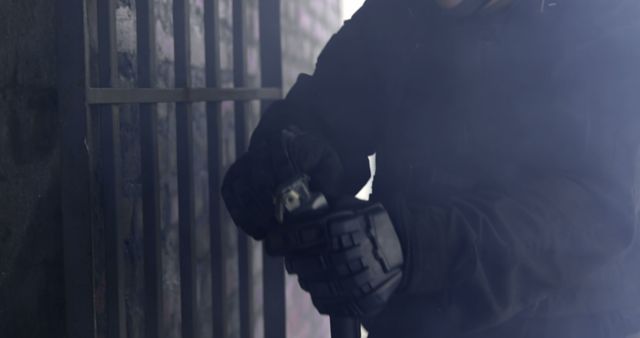 Masked Intruder Using Bolt Cutters on Metal Barred Door - Download Free Stock Images Pikwizard.com