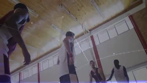 Male Athletes Competing in Indoor Sports Game with Analytics Visualization