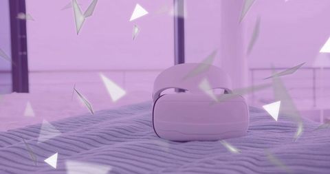 White virtual reality headset with falling geometric shapes