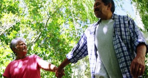 Senior Latino Couple Enjoying Leisurely Walk Outdoors - Download Free Stock Images Pikwizard.com