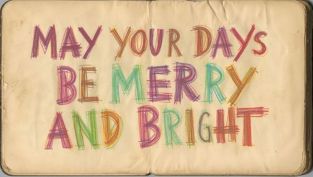 Hand-lettered multicolor holiday greeting on vintage journal pages with textured parchment